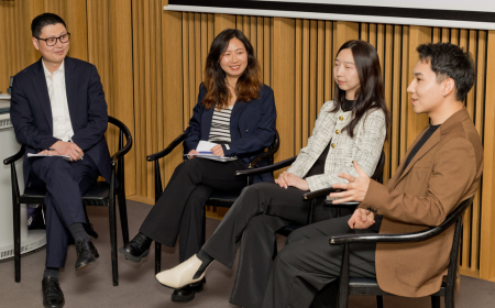 Four UCD alumni speaking on a panel.